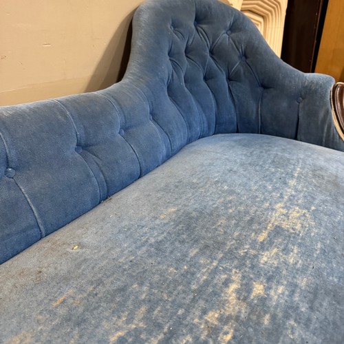 348 - A Victorian mahogany chaise longue buttoned blue velvet upholstery, swept upright and knopped legs w... 