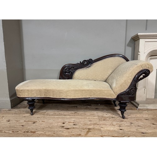 349 - A Victorian mahogany framed chaise longue, pierced and carved foliate back on turned legs with caste... 