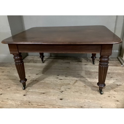 350 - A Victorian mahogany extending dining table with two leaves, rounded corners and on reeded and turne... 