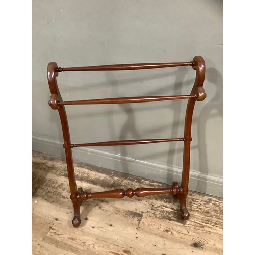 357 - A Victorian mahogany towel rail on serpentine uprights, three cross bars and bifurcated legs