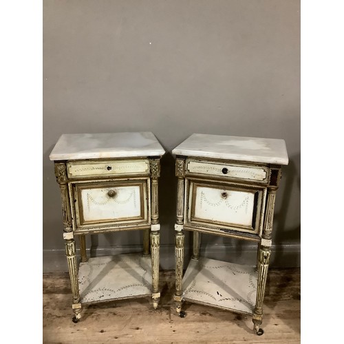 358 - A pair of 19th century marble and painted pot cupboards having a shallow drawer above a drop down fr... 