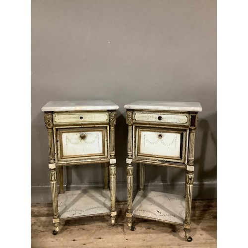 358 - A pair of 19th century marble and painted pot cupboards having a shallow drawer above a drop down fr... 