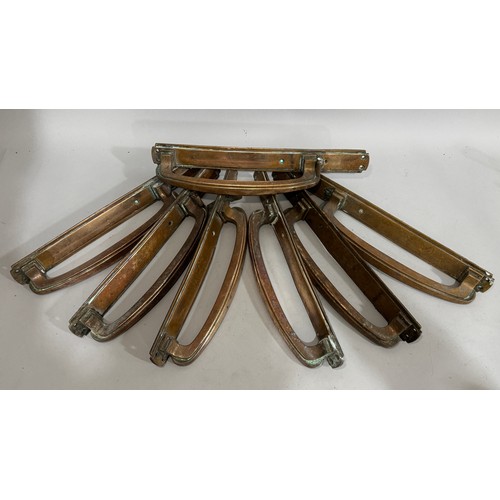 74 - A set of six matching brass door handles together with one associated