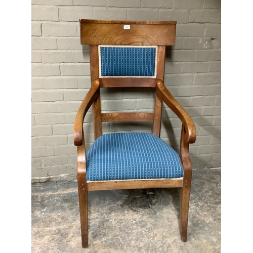 148 - A large high backed fruitwood armchair on splayed legs, with blue upholstered seat and back