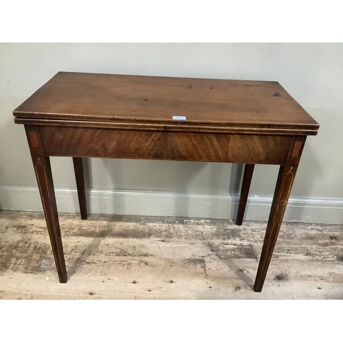 354 - An early 19th century mahogany and satin wood inlaid tea table having a rectangular fold over top an... 