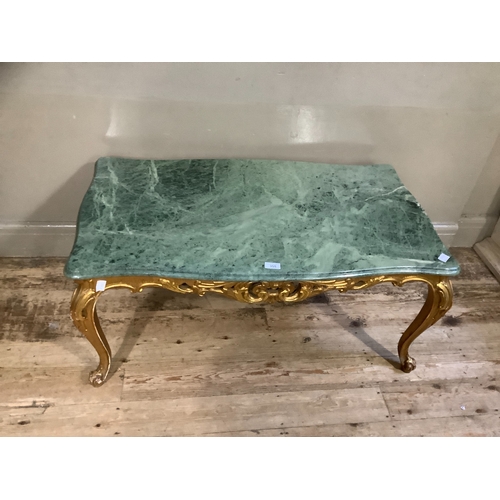 355 - A marble and gilt coffee table, serpentine outline and on leaf carved cabriole legs and with carved ... 