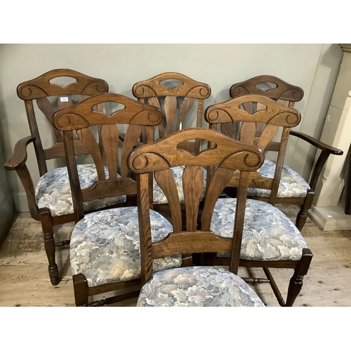 362 - A set of six oak dining chairs, four single and two carvers