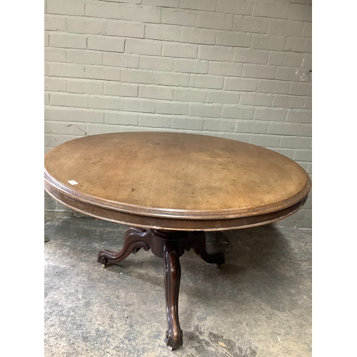 365 - A Victorian mahogany looe table, the mahogany circular tilt top on a tripod base