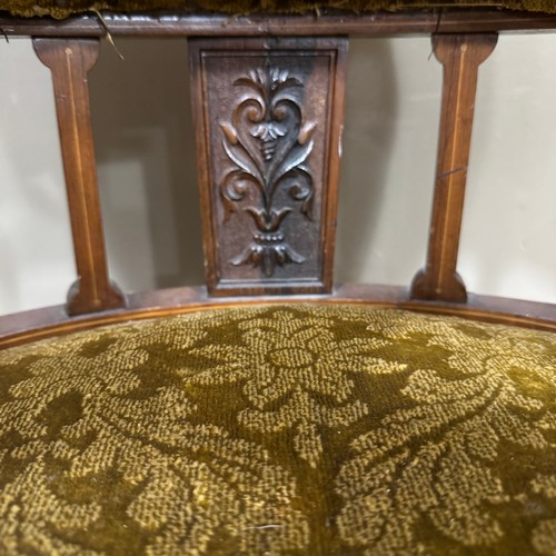 317 - An Edwardian mahogany inlaid tub chair