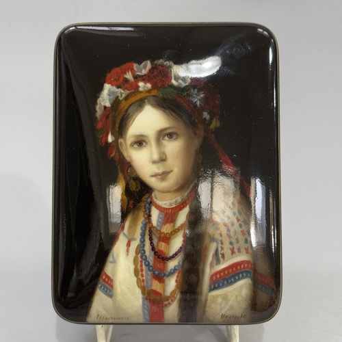 2 - A Russian lacquered box, the cover painted with a young girl in traditional costume, signed to lower... 