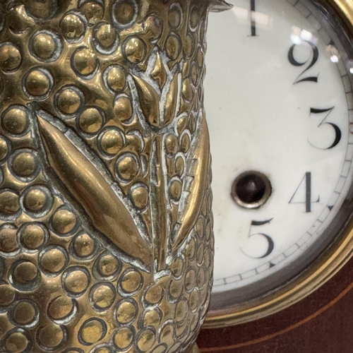 274 - An Edwardian mahogany and satinwood inlaid mantel clock of lancet shape, enamelled dial with black A... 