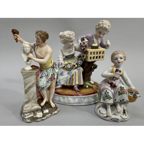 46 - A German figure group of girl and boy with garland of flowers and birdcage, underglaze blue