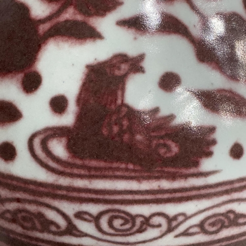 7 - A modern Chinese vase of tear shape with everted rim in wine with a continuous scene of water fowl a... 