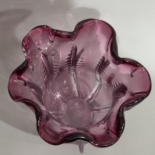 8 - An amethyst glass vase of flower bud form with folded rim, 27cm high