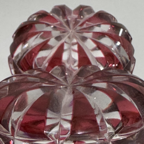 9 - A pair of ruby flash cut glass decanters with mushroom stoppers, 21.5cm