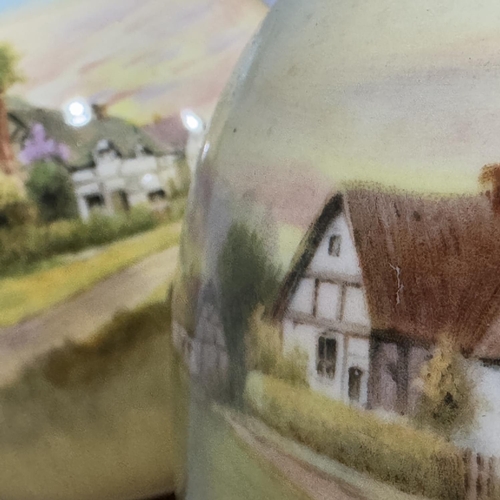 25B - A pair of Royal Doulton vases printed and painted with cottages in a landscape, 14cm high together w... 