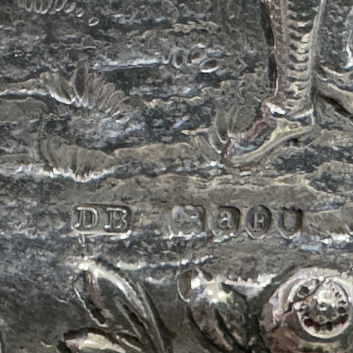 341 - A Danish silver trinket dish embossed with a gentleman and his wife with C-scrolls, rocaille and fru... 