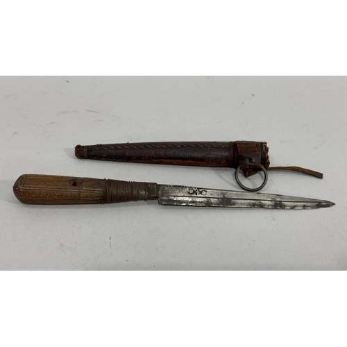 59 - A late 18th early 19th century steel blade knife, wooden handled and wire wrapped in a leather scabb... 