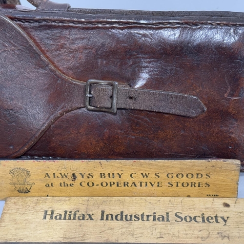 64 - Two vintage rulers, London made, and one for the Co-Operative Stores, the other Halifax Industrail S... 