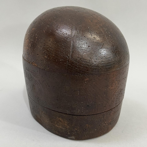 66 - An early 20th century hat block, 18.5cm high