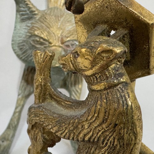 55B - Two brass door knockers, one in the form of a bear and the other as a fox mask