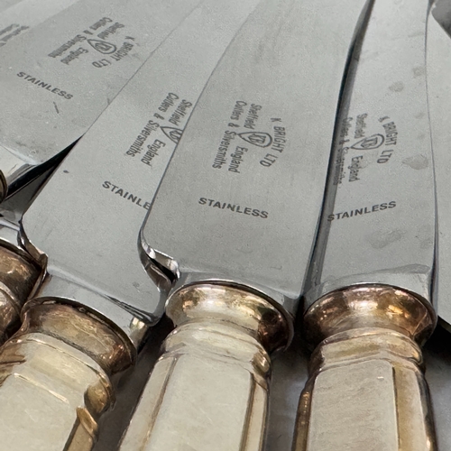 309 - A suite of silver plated cutlery including six table knives and forks, six dessert knives, forks and... 