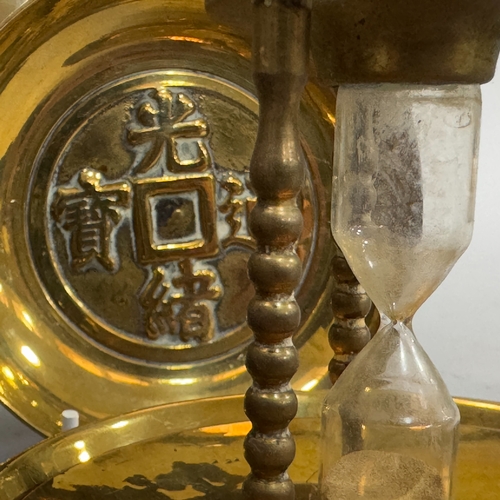 278 - A brass spirit kettle with turned ebonised handle, oval brass kettle, trivets, Indian brass cigarett... 