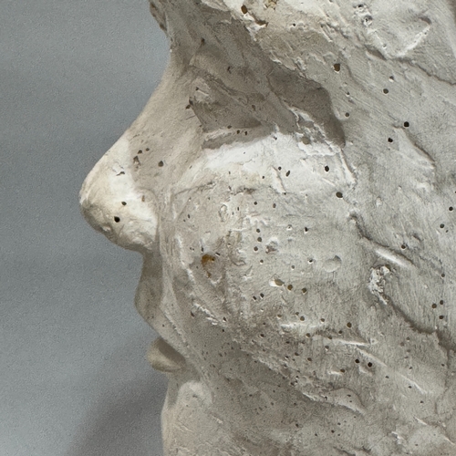 318 - A plaster bust of a young boy, 39cm