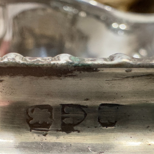 331 - A silver two handled sugar bowl on bun feet (marks rubbed) and an open salt, 5oz