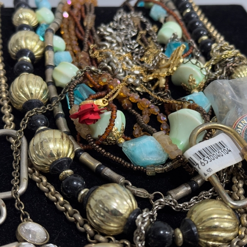 374 - A box of costume jewellery including chains, faux pearls, earrings, necklaces, cufflinks, bracelets,... 