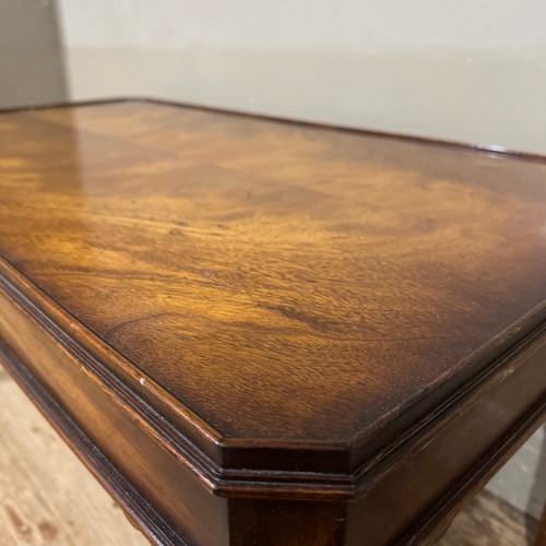 226 - A mahogany finish coffee table, rectangular with canted corners, on square legs with ankle brackets,... 