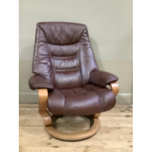 229 - A Himolla  brown leather reclining chair on round swivel base