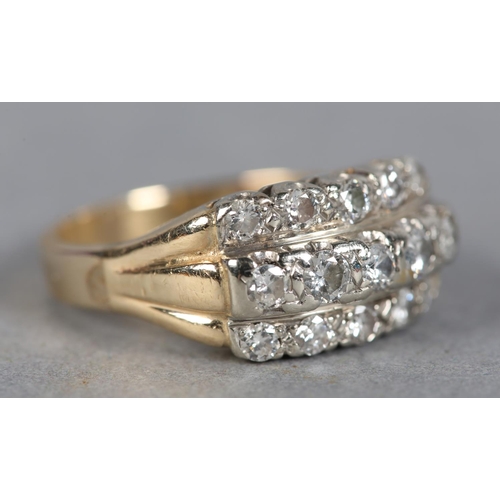 360 - A DIAMOND RING c1970, the brilliant cut stones set in three rows in line, in yellow and white metal ... 