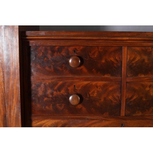 413 - AN EARLY VICTORIAN FIGURED MAHOGANY WARDROBE-CHEST, the centre section having two dummy drawer cupbo... 