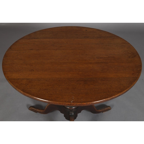 448 - AN EARLY 19TH CENTURY OAK TILT TOP TABLE, circular, vase turned pedestal on three cabriole legs, 90c... 