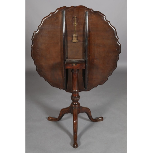 455 - A GEORGE III MAHOGANY TILT TOP TABLE, circular with pie crust rim on a writhern vase turned pedestal... 