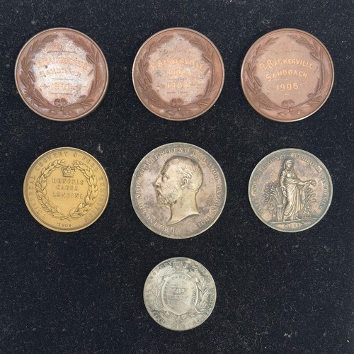 352 - A group of seven Edwardian prize medallions awarded in various cookery and food exhibitions and most... 