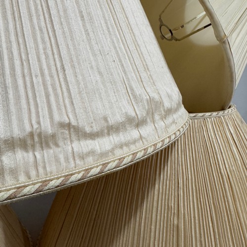 328 - Two pairs of pleated silk lampshades in ivory, 30.5cm high x 51cm and 35cm high x 56cm together with... 