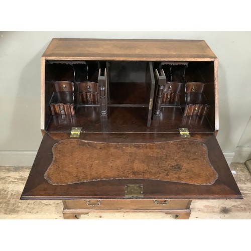 454 - A 1960s walnut and mahogany walnut bureau with four graduated drawers, fitted interior comprising pi... 