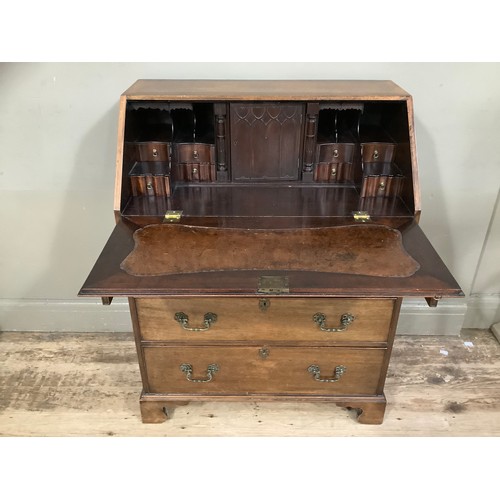 454 - A 1960s walnut and mahogany walnut bureau with four graduated drawers, fitted interior comprising pi... 