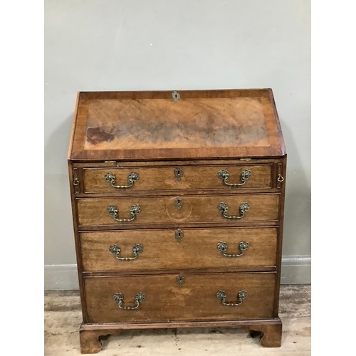 454 - A 1960s walnut and mahogany walnut bureau with four graduated drawers, fitted interior comprising pi... 