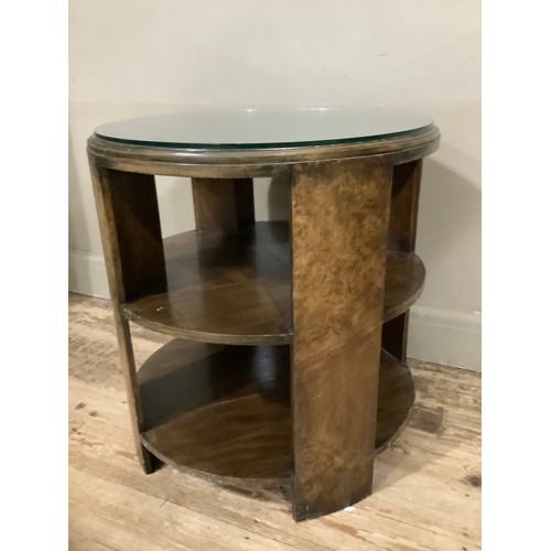 460 - A circular 1920s walnut occasional table with shelves, 60cm x 62cm high