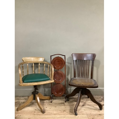 463 - Two 1930s oak office chairs together with an inlaid cake stand