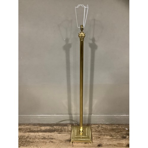 401 - A reproduction brass standard lamp on Corinthian column and on square base