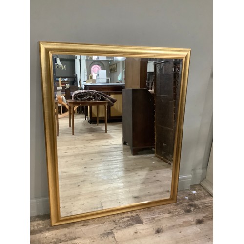 300 - A large bevelled gilt framed wall mirror, 104cm x 127cm