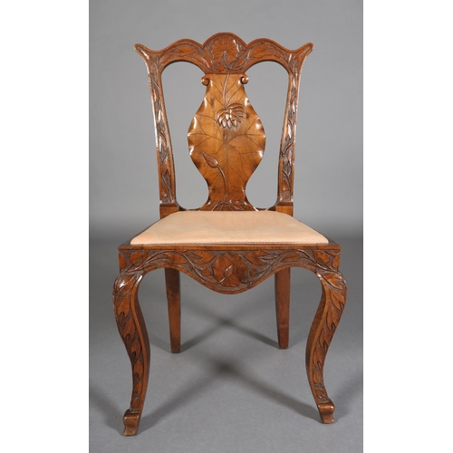 99 - A late 19th century Anglo Indian walnut sideboard and pair of single chairs, all-over carved in low ... 