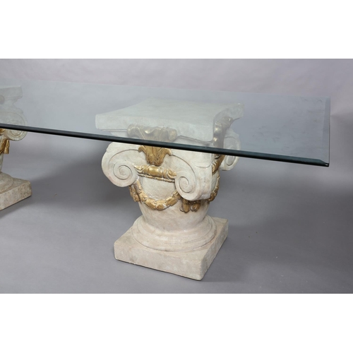 168 - A large glass dining table, rectangular, on two faux stone pedestals of urn and scroll design with g... 