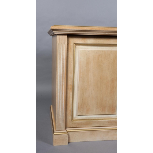 149 - A washed wood finish side cabinet of three field panelled doors, on plinth base, 176cm wide x 55cm d... 