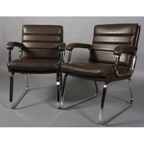 24 - Gordon Russell for Verco, c1970s, a pair of brown leather and chrome office desk chairs