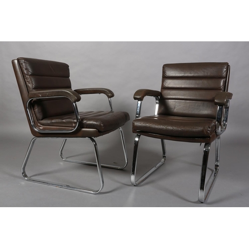 24 - Gordon Russell for Verco, c1970s, a pair of brown leather and chrome office desk chairs